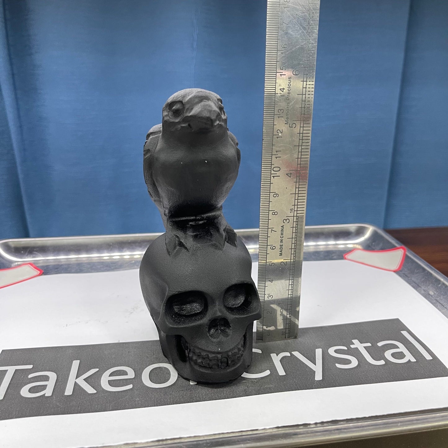 Crow skull obsidian carving