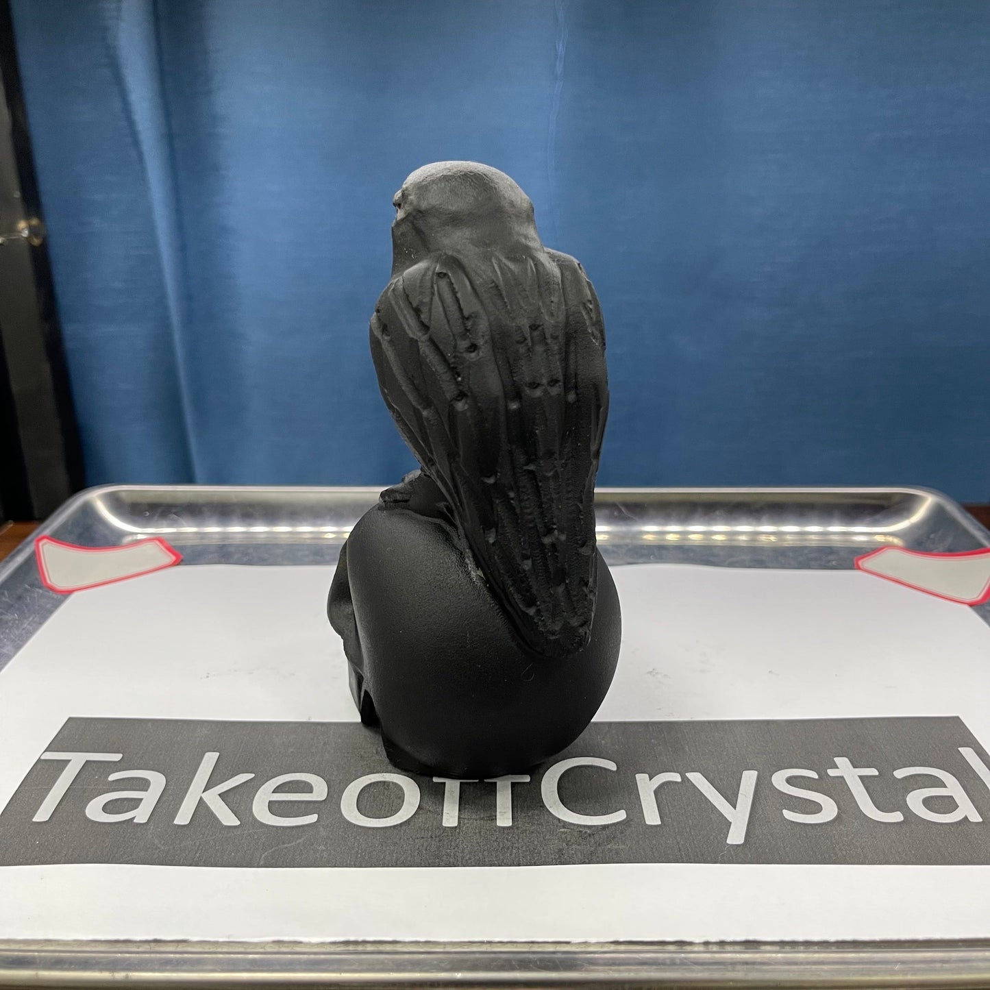 Crow skull obsidian carving