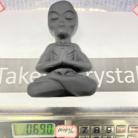 Obsidian sitting Alien carving